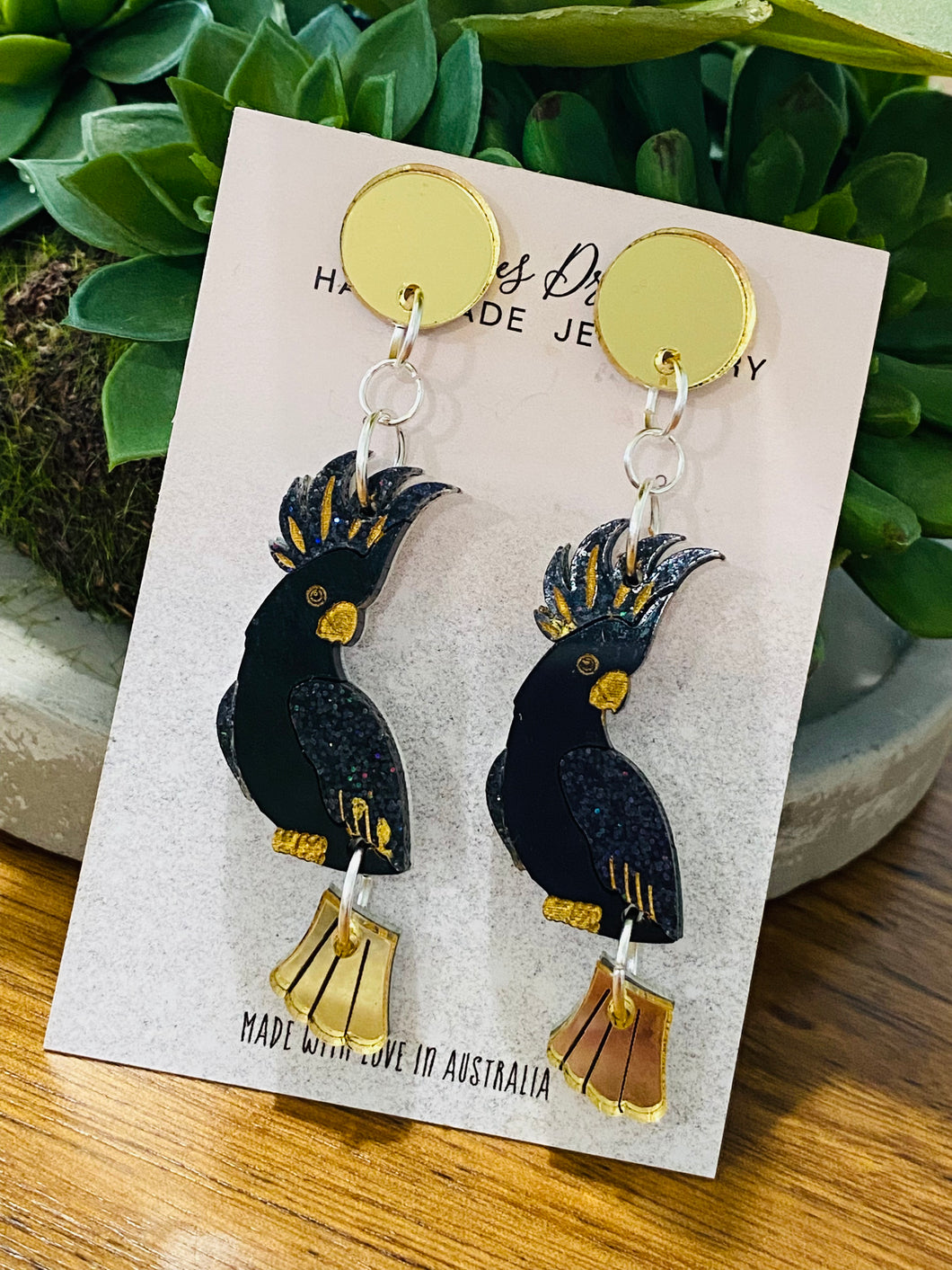 Black cockatoo/ gold dangle tail